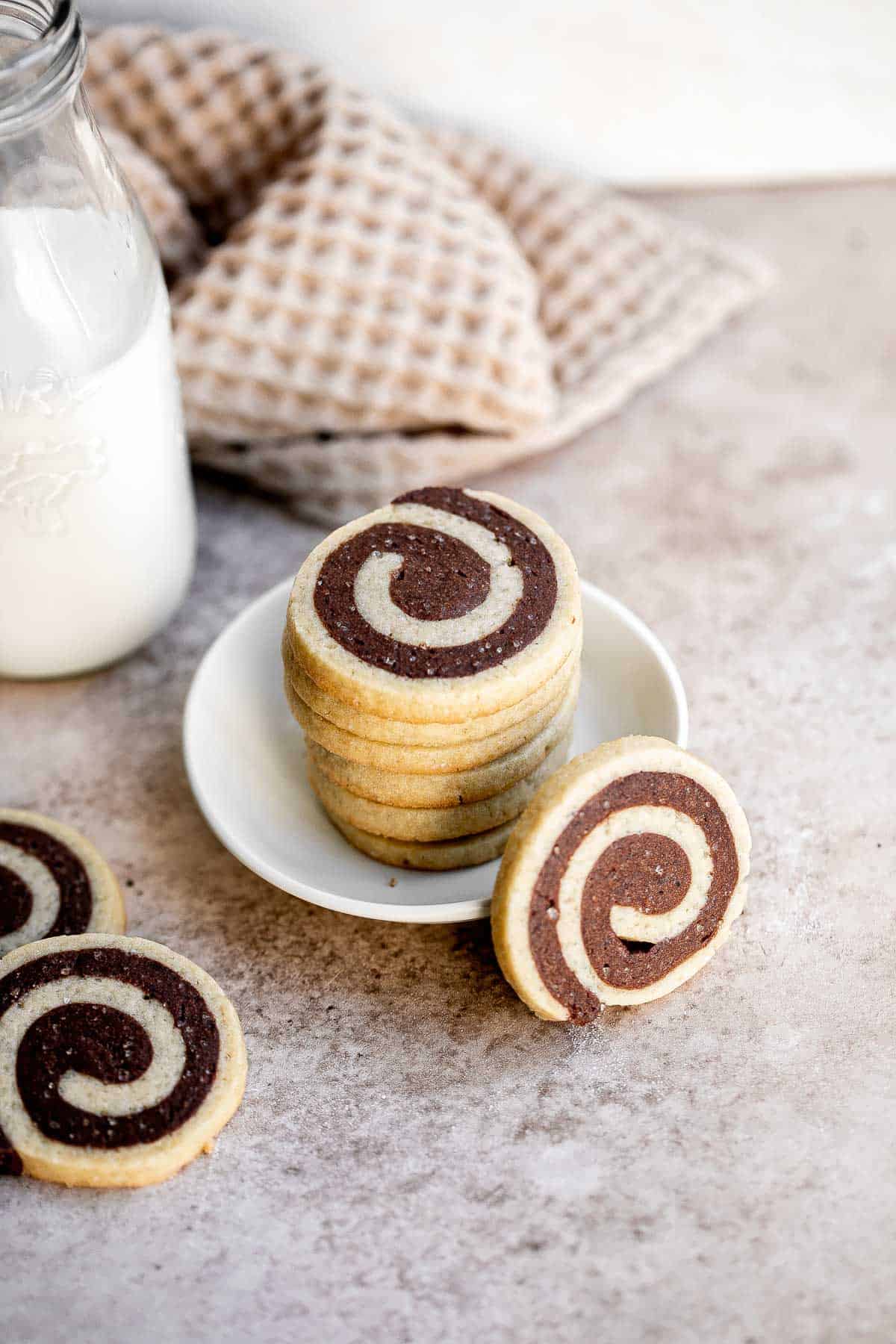 Chocolate Pinwheel Cookies are a Christmastime classic — sweet, buttery, and melt in your mouth delicious. Plus, an easy to make slice-and-bake cookie. | aheadofthyme.com