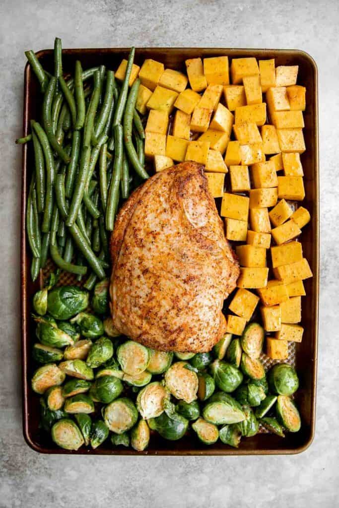 This Sheet Pan Thanksgiving Dinner is the easiest way to serve a small turkey dinner with sides. Ready in just an hour and half, this will change your life! | aheadofthyme.com