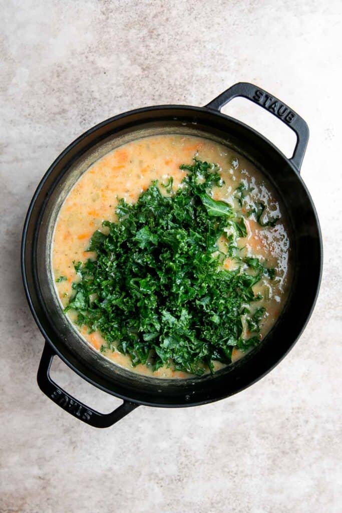 White Bean Soup with Kale is a hearty and nourishing one-pot meal that is flavorful and easy. Make this healthy soup in 30 minutes using simple ingredients. | aheadofthyme.com