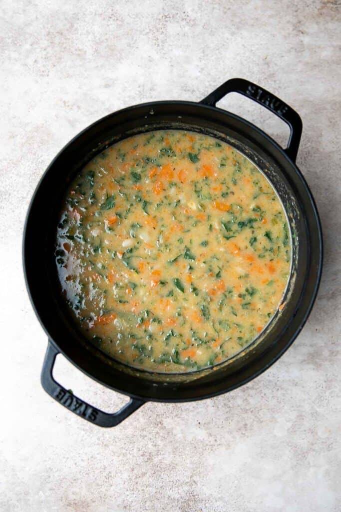 White Bean Soup with Kale is a hearty and nourishing one-pot meal that is flavorful and easy. Make this healthy soup in 30 minutes using simple ingredients. | aheadofthyme.com