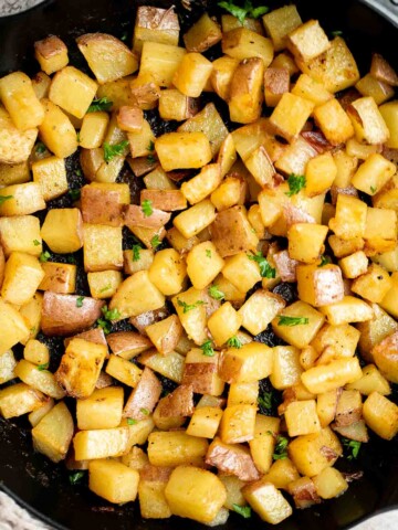 Breakfast Potatoes are crispy on the outside while soft and tender inside. These skillet potatoes are delicious, flavorful, and ready in 30 minutes. | aheadofthyme.com