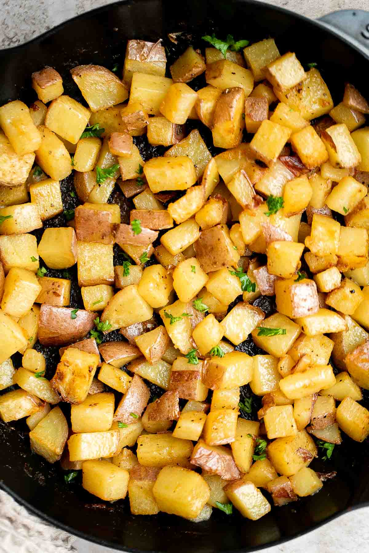 Breakfast Potatoes are crispy on the outside while soft and tender inside. These skillet potatoes are delicious, flavorful, and ready in 30 minutes. | aheadofthyme.com