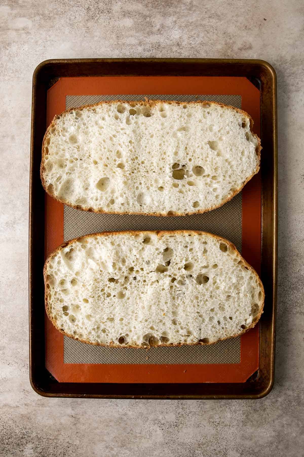 Cheesy Garlic Bread is toasty and crispy on the outside, tender and soft inside with a garlic butter and melty cheese on top. Make in under 20 minutes! | aheadofthyme.com