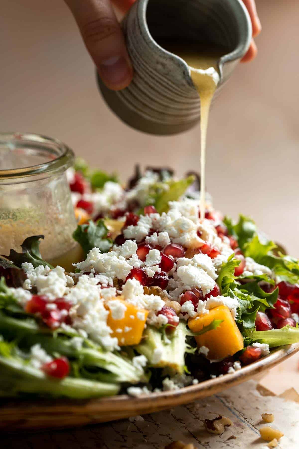 This fresh and festive Christmas Salad is made with delicious winter fruits and has a gorgeous wreath-like appearance. It’s earthy, sweet, nutty, and tangy. | aheadofthyme.com