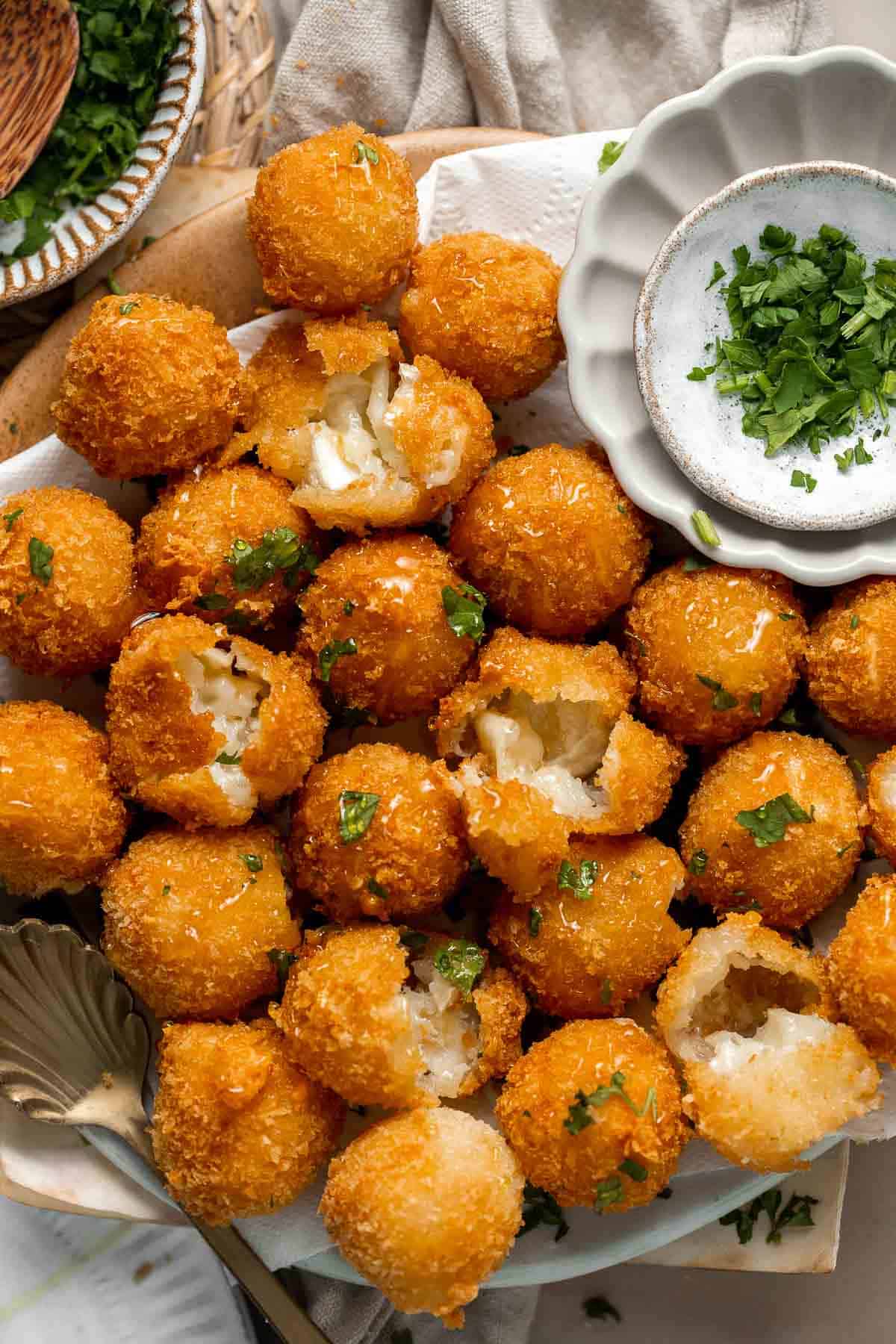 Fried Goat Cheese Balls are flavorful, delicious, and easy to make. With creamy, melty cheese oozing out of a crunchy, golden crust in every bite. | aheadofthyme.com