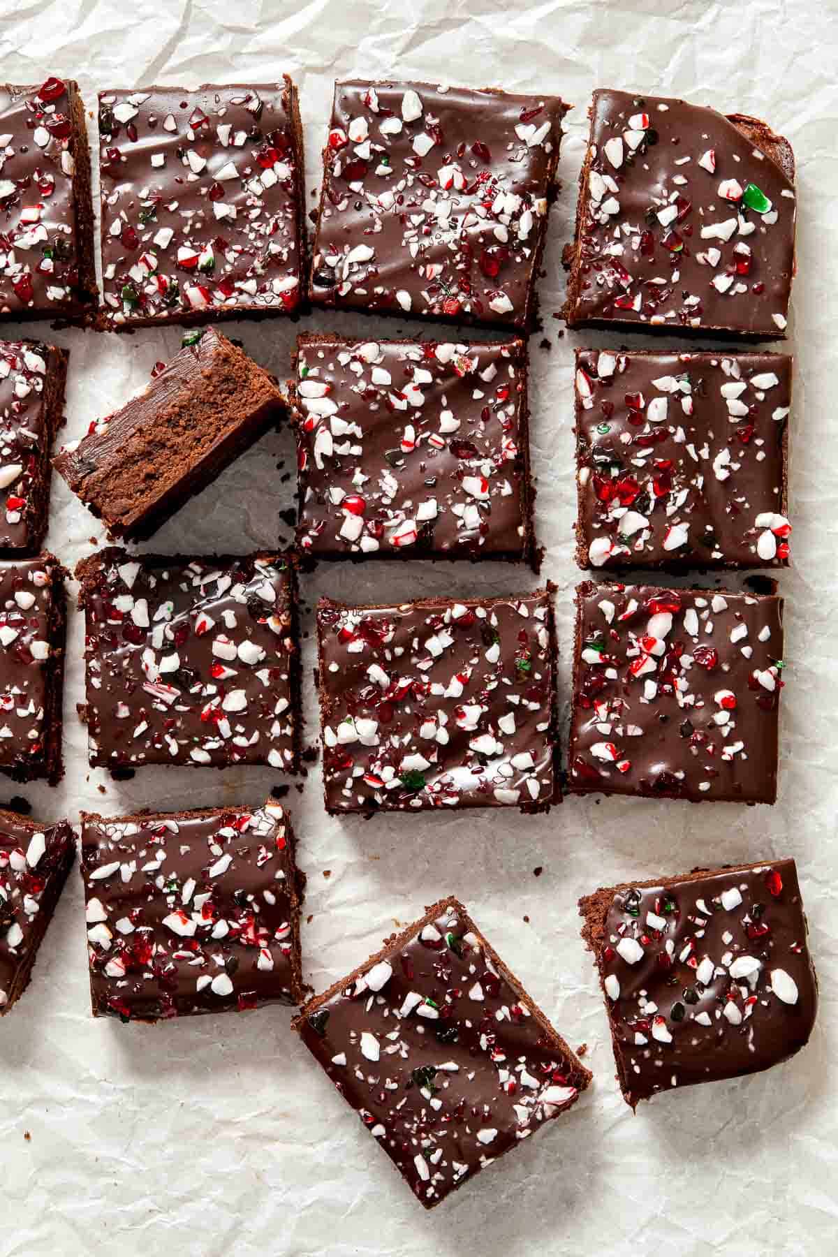 Peppermint Brownies are rich and decadent with a fudgy brownie base, a delicious minty chocolate ganache layer, and crushed candy canes sprinkled on top. | aheadofthyme.com