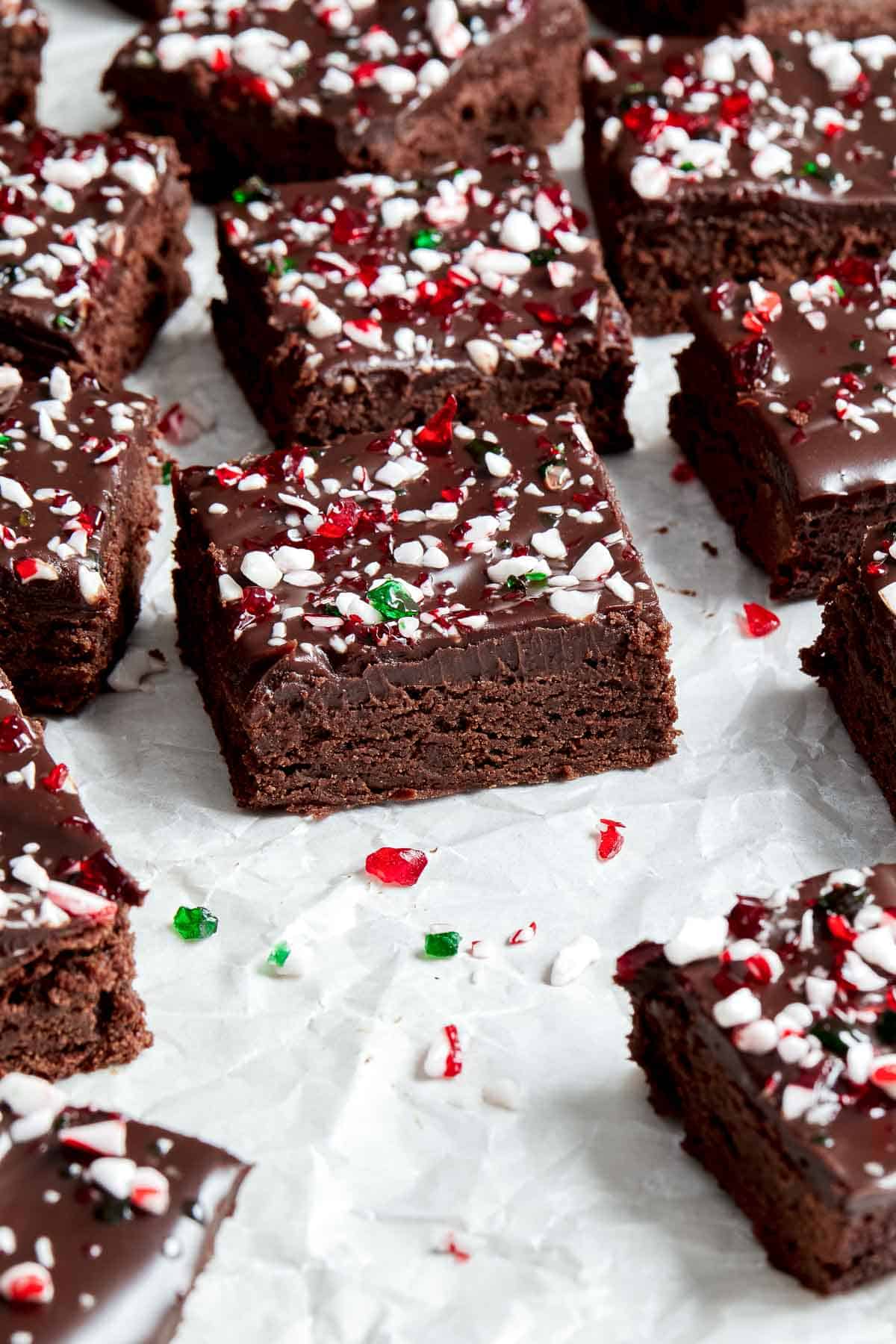 Peppermint Brownies are rich and decadent with a fudgy brownie base, a delicious minty chocolate ganache layer, and crushed candy canes sprinkled on top. | aheadofthyme.com