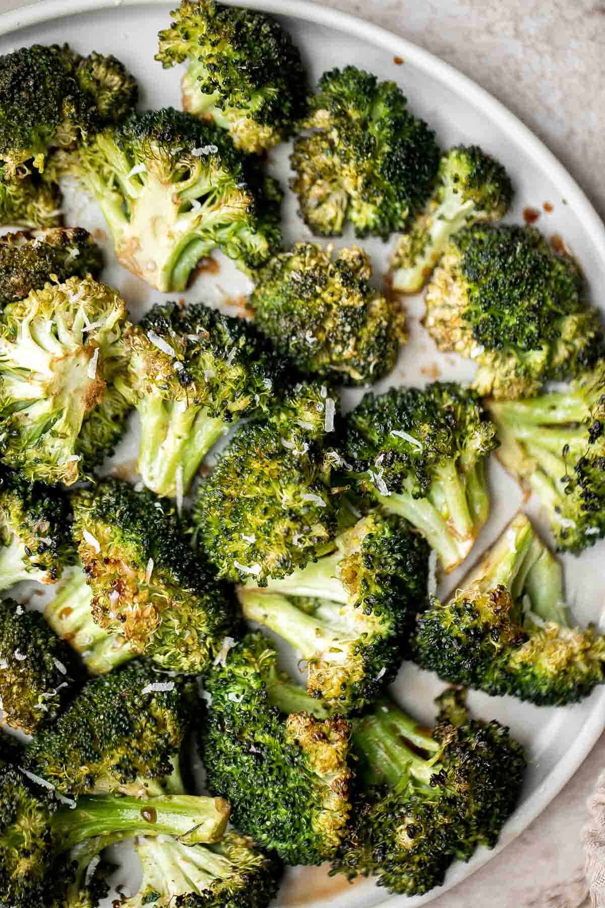 Balsamic Roasted Broccoli is a quick easy side dish made with tender, crispy broccoli tossed in a flavorful 5-ingredient glaze and is ready in 25 minutes. | aheadofthyme.com