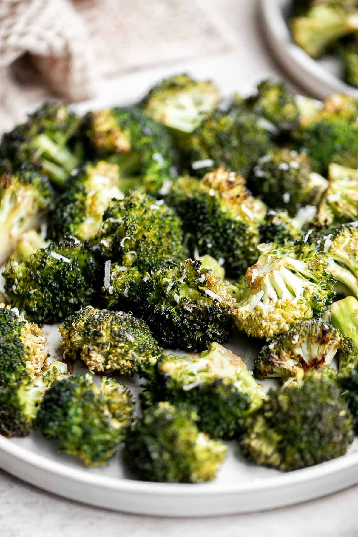 Balsamic Roasted Broccoli is a quick easy side dish made with tender, crispy broccoli tossed in a flavorful 5-ingredient glaze and is ready in 25 minutes. | aheadofthyme.com