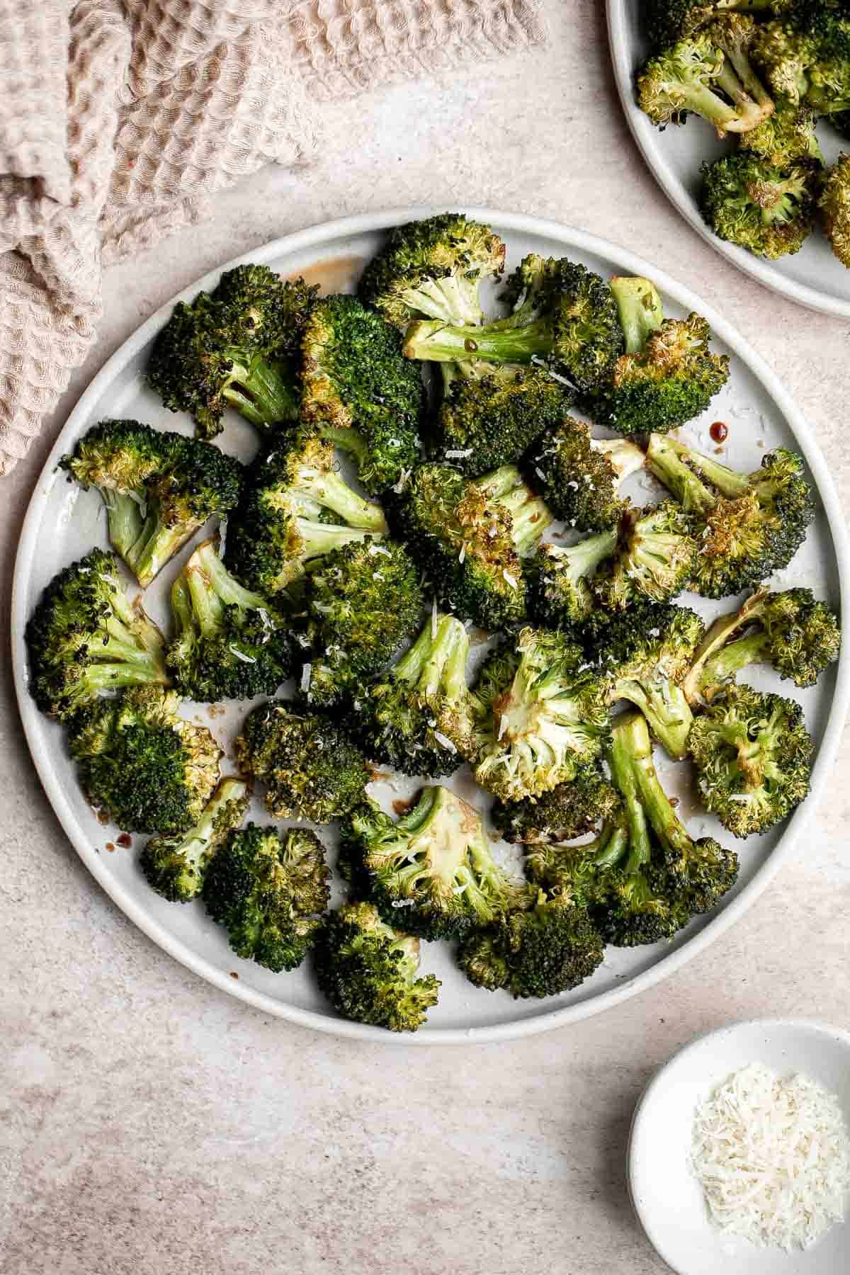 Balsamic Roasted Broccoli is a quick easy side dish made with tender, crispy broccoli tossed in a flavorful 5-ingredient glaze and is ready in 25 minutes. | aheadofthyme.com