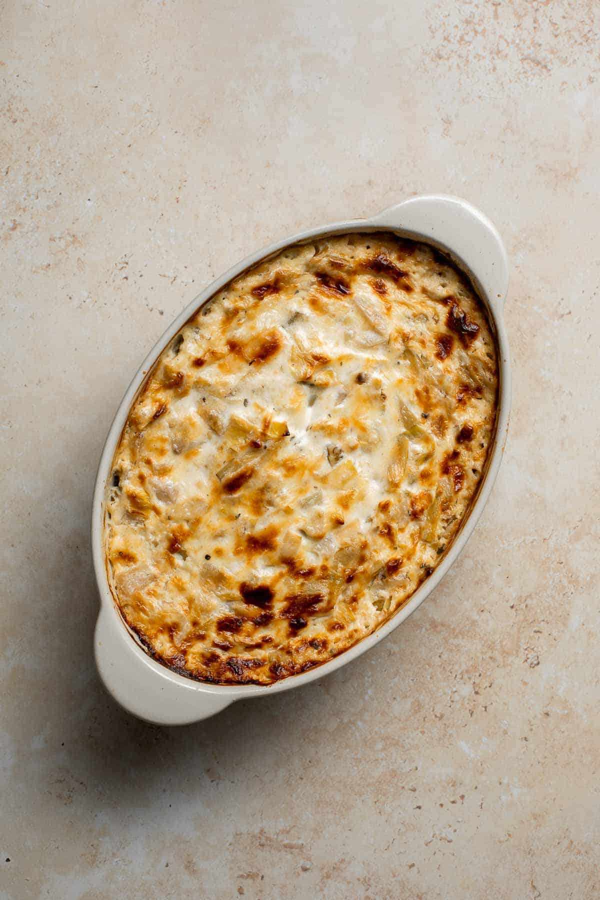 Homemade artichoke dip is a warm, creamy dip loaded with tender artichoke hearts. This easy to make appetizer is tangy, cheesy, and all-around delicious! | aheadofthyme.com