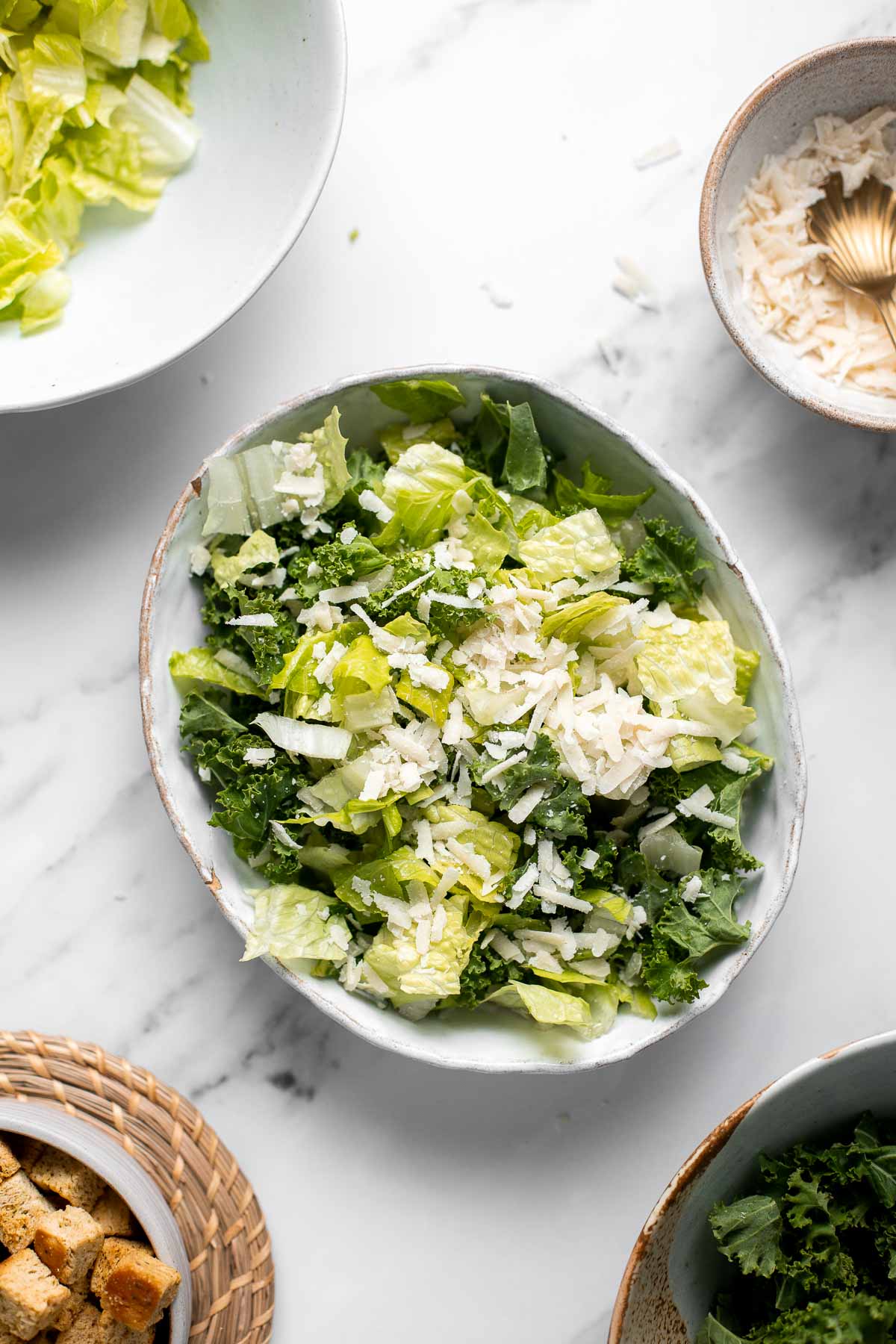 Kale Caesar Salad is a delicious, healthy twist on classic Caesar salad with all the traditional flavors but added crunch and rich earthiness of fresh kale. | aheadofthyme.com