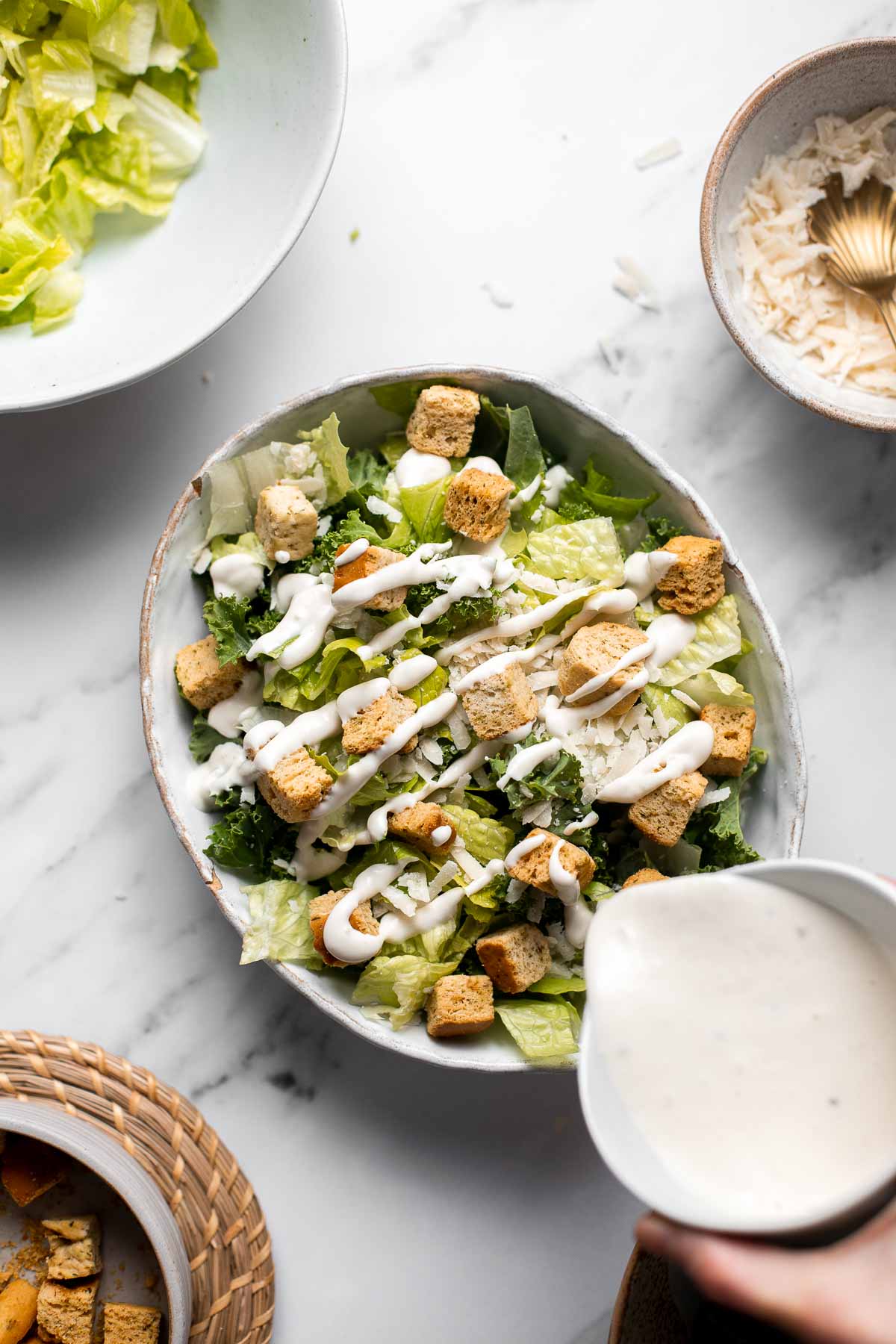 Kale Caesar Salad is a delicious, healthy twist on classic Caesar salad with all the traditional flavors but added crunch and rich earthiness of fresh kale. | aheadofthyme.com