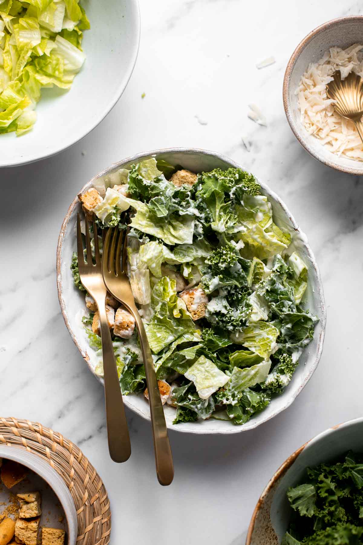 Kale Caesar Salad is a delicious, healthy twist on classic Caesar salad with all the traditional flavors but added crunch and rich earthiness of fresh kale. | aheadofthyme.com