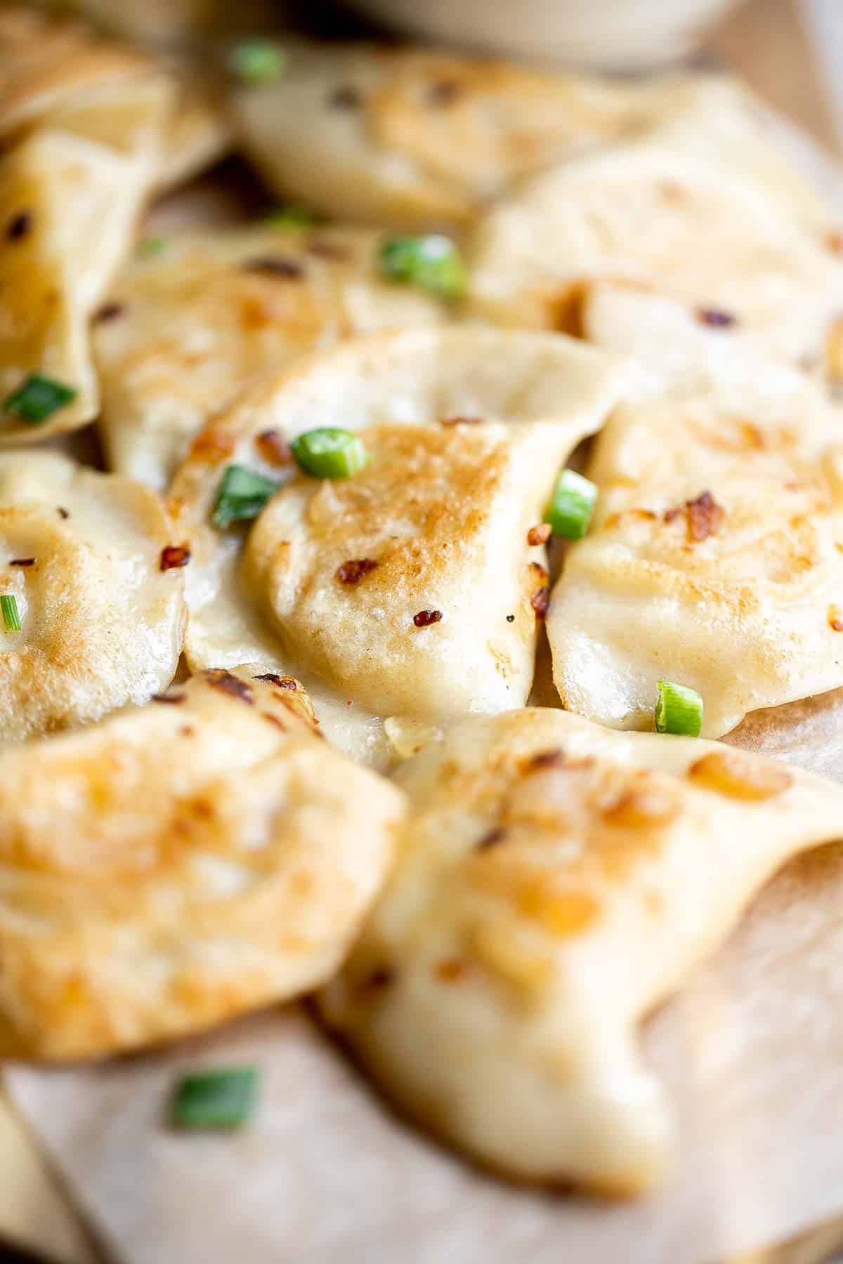 Potato Onion Pierogi is a flavorful delicious dumpling recipe made from scratch with simple ingredients, filled potatoes, caramelized onions, and cheese. | aheadofthyme.com