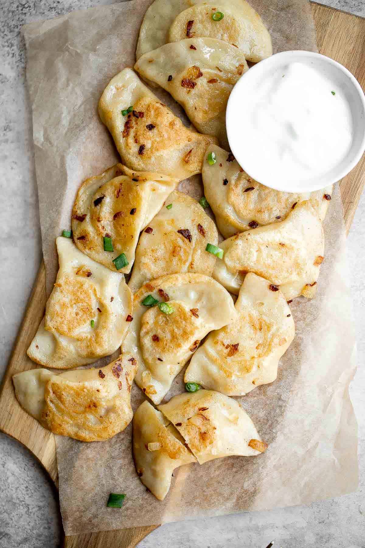 Potato Onion Pierogi is a flavorful delicious dumpling recipe made from scratch with simple ingredients, filled potatoes, caramelized onions, and cheese. | aheadofthyme.com