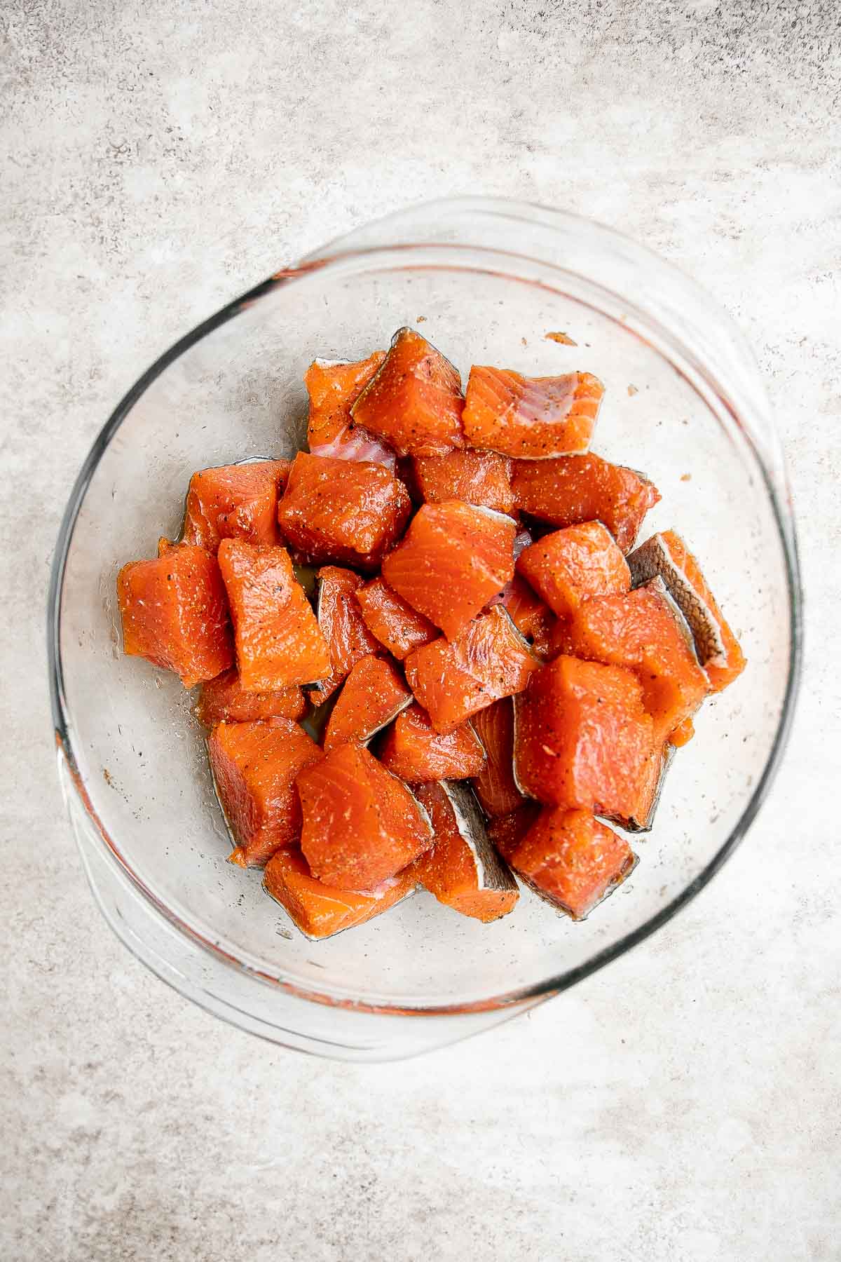 Salmon Bites are flavorful and delicious bite-sized pieces of salmon cooked until tender with crispy, golden edges and coated with an homemade sticky glaze. | aheadofthyme.com