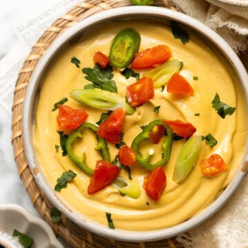 Vegan Queso is a 5-minute dip that is creamy, cheesy, and perfectly spiced to mimic the classic dip — without any dairy! It tastes like the real thing! | aheadofthyme.com