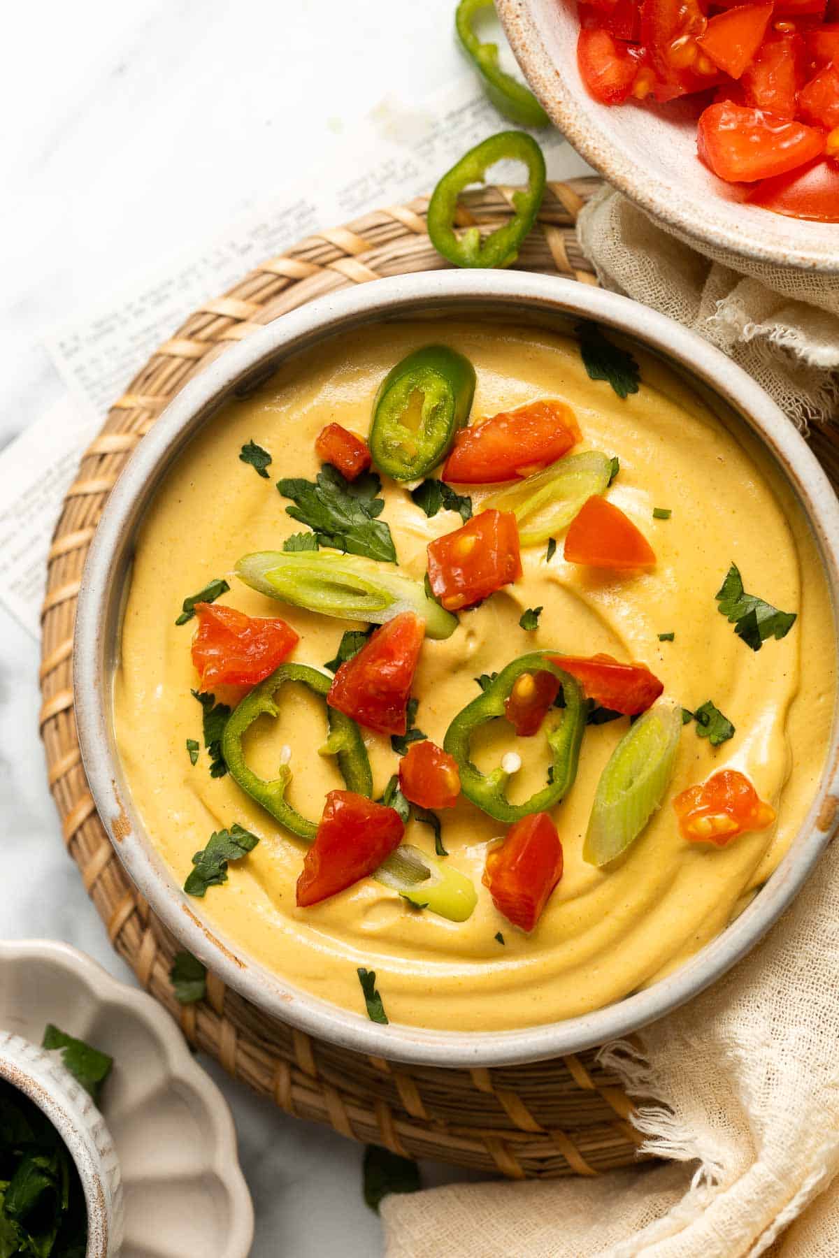 Vegan Queso is a 5-minute dip that is creamy, cheesy, and perfectly spiced to mimic the classic dip — without any dairy! It tastes like the real thing! | aheadofthyme.com