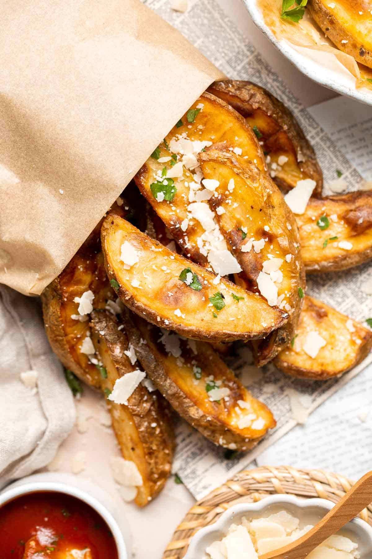 Baked Potato Wedges are crispy outside and soft inside — exactly what you want from a potato wedge but without frying! Cook in the oven or air fryer. | aheadofthyme.com