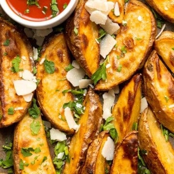 Baked Potato Wedges are crispy outside and soft inside — exactly what you want from a potato wedge but without frying! Cook in the oven or air fryer. | aheadofthyme.com