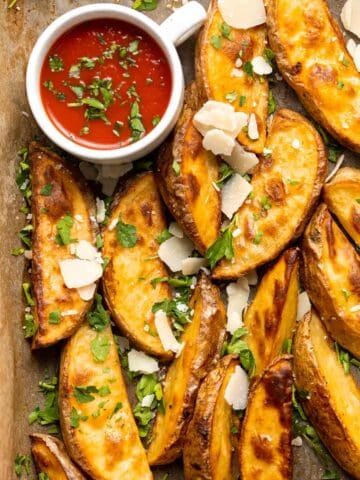 Baked Potato Wedges are crispy outside and soft inside — exactly what you want from a potato wedge but without frying! Cook in the oven or air fryer. | aheadofthyme.com