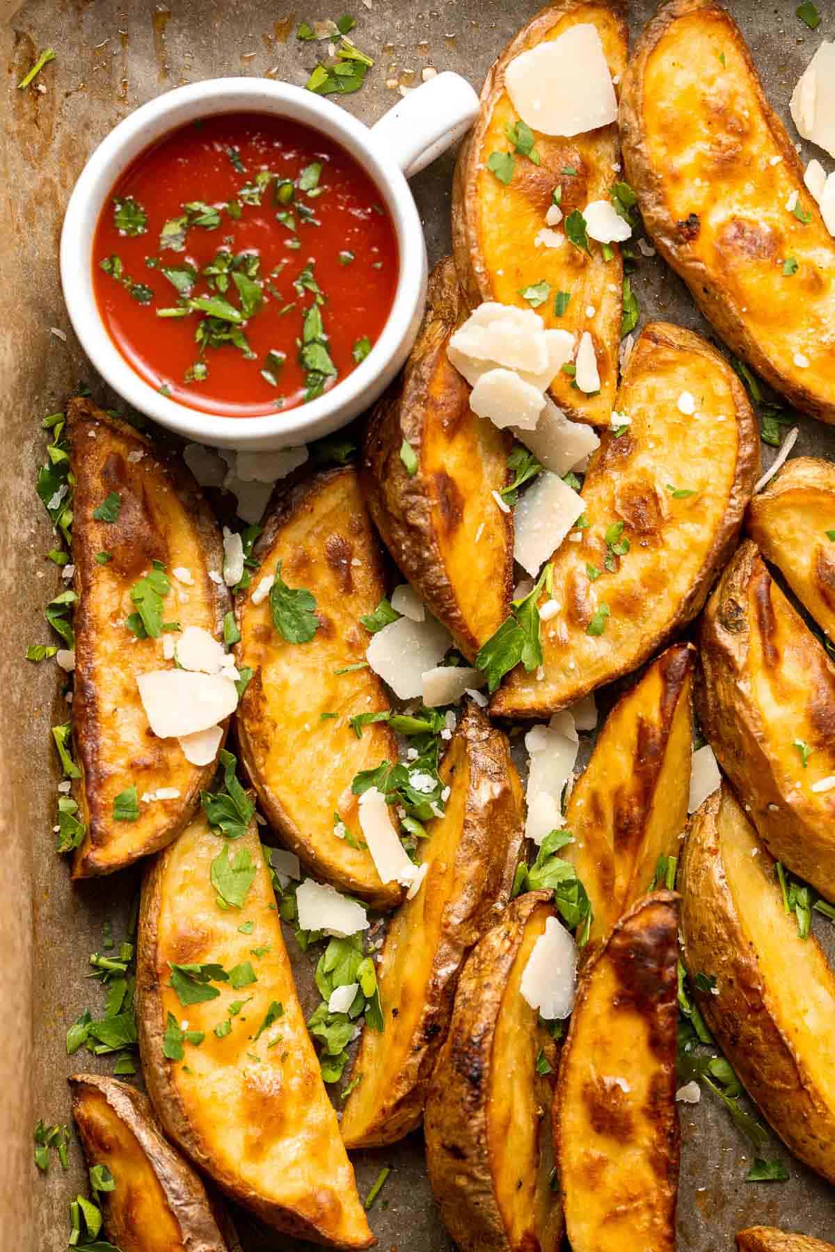 Baked Potato Wedges are crispy outside and soft inside — exactly what you want from a potato wedge but without frying! Cook in the oven or air fryer. | aheadofthyme.com