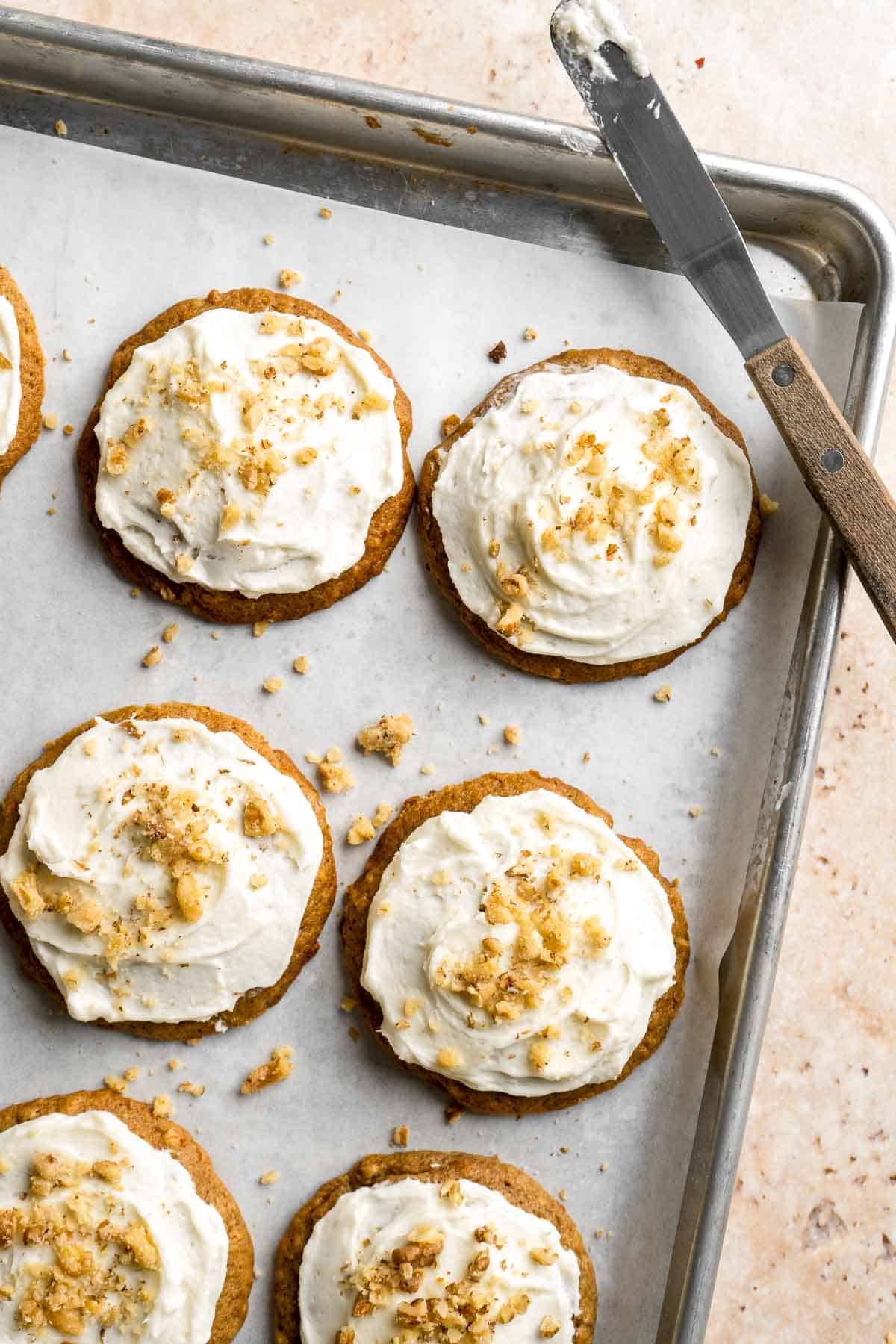 Carrot Cake Cookies are soft, chewy, cake-like cookies with a delicious homemade cream cheese glaze. They taste just like carrot cake but in cookie form. | aheadofthyme.com