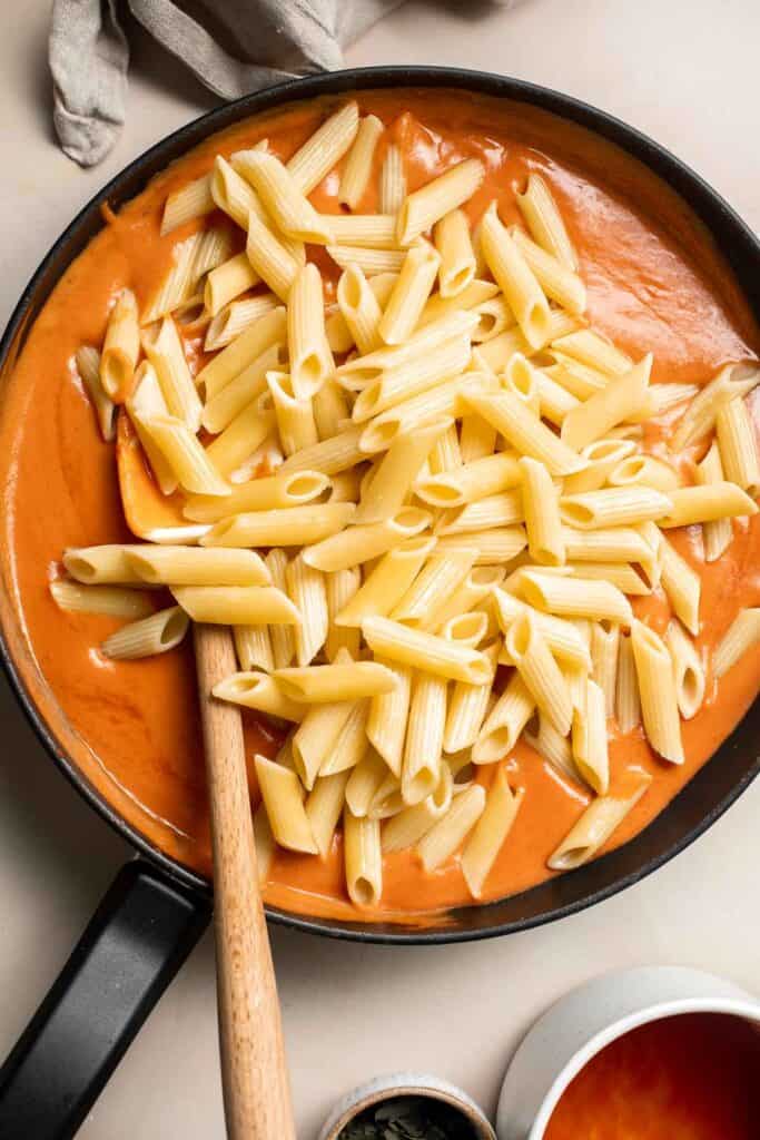 This Creamy Tomato Pasta is a simple and delicious meal made from scratch in 20 minutes with a cream and tomato based sauce that is rich and silky smooth. | aheadofthyme.com