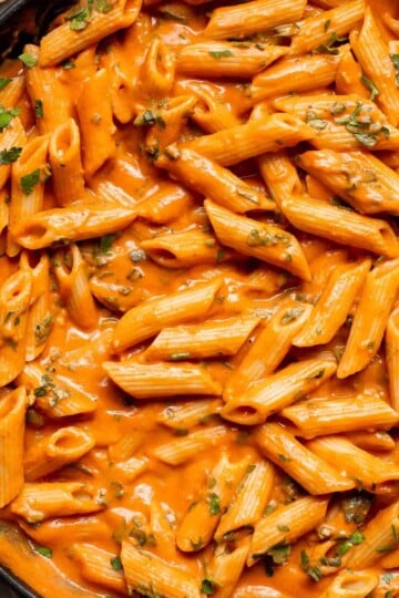 This Creamy Tomato Pasta is a simple and delicious meal made from scratch in 20 minutes with a cream and tomato based sauce that is rich and silky smooth. | aheadofthyme.com