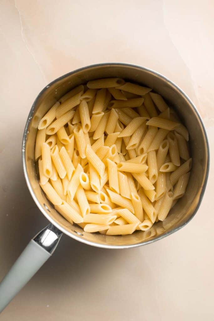 This Creamy Tomato Pasta is a simple and delicious meal made from scratch in 20 minutes with a cream and tomato based sauce that is rich and silky smooth. | aheadofthyme.com