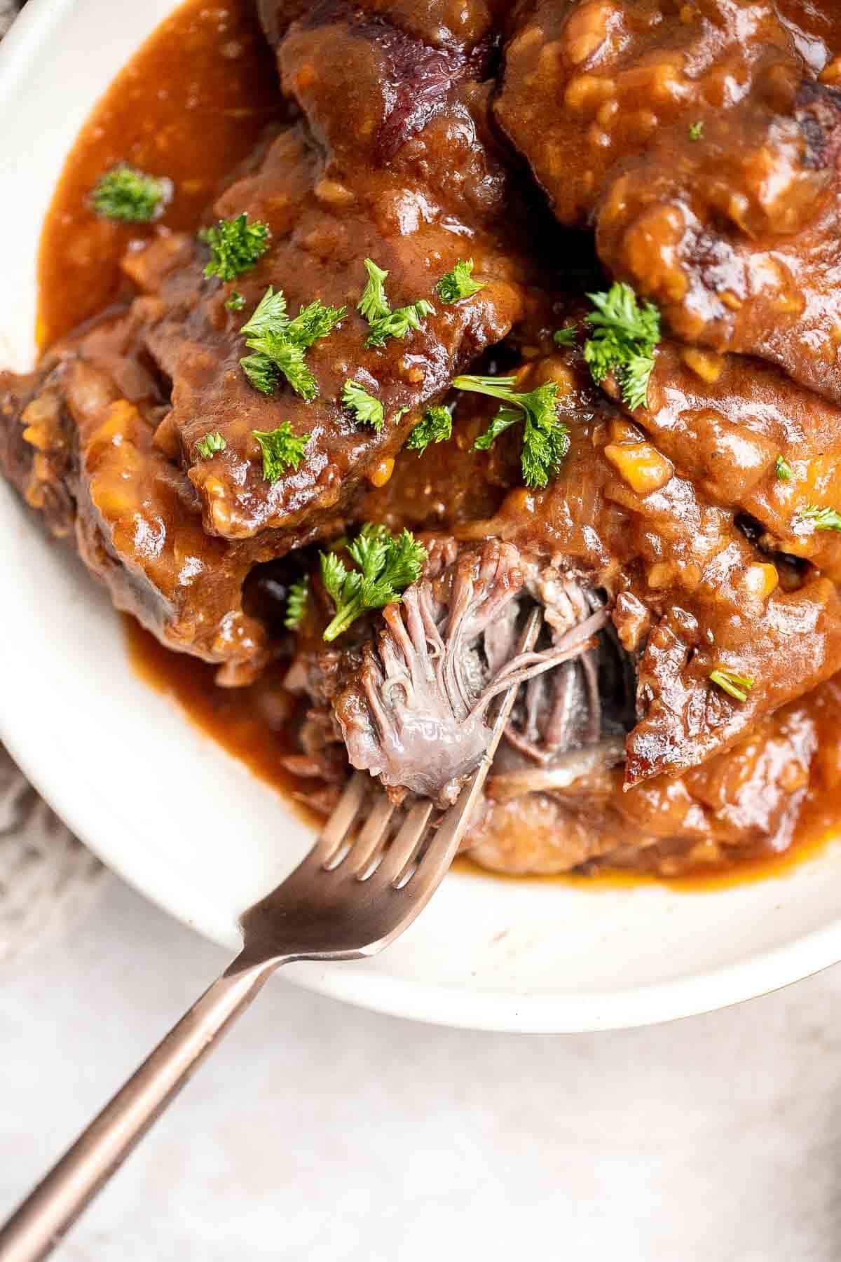 Instant Pot Short Ribs are rich, tender, and delicious. These short ribs fall-off-the-bone after being braised in a red wine broth in the pressure cooker. | aheadofthyme.com