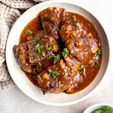 Instant Pot Short Ribs are rich, tender, and delicious. These short ribs fall-off-the-bone after being braised in a red wine broth in the pressure cooker. | aheadofthyme.com