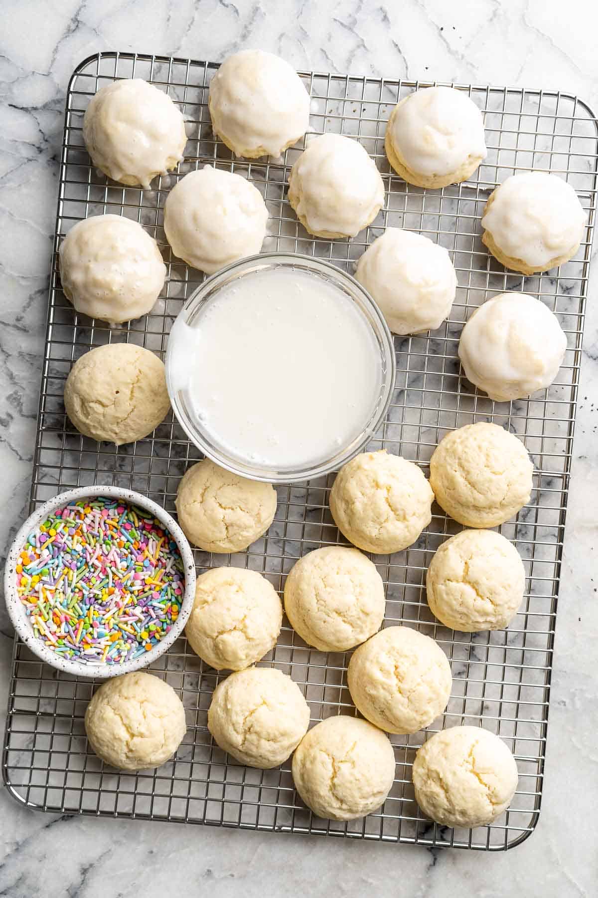 Italian Easter Cookies are cake-like cookies that are light and fluffy with lemon flavor throughout and topped with an easy homemade glaze and sprinkles. | aheadofthyme.com