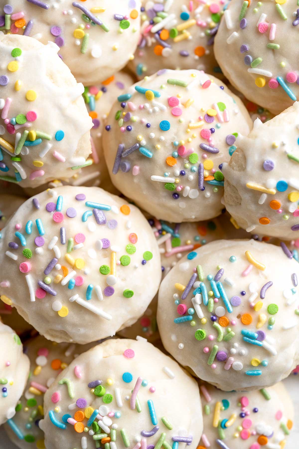 Italian Easter Cookies are cake-like cookies that are light and fluffy with lemon flavor throughout and topped with an easy homemade glaze and sprinkles. | aheadofthyme.com