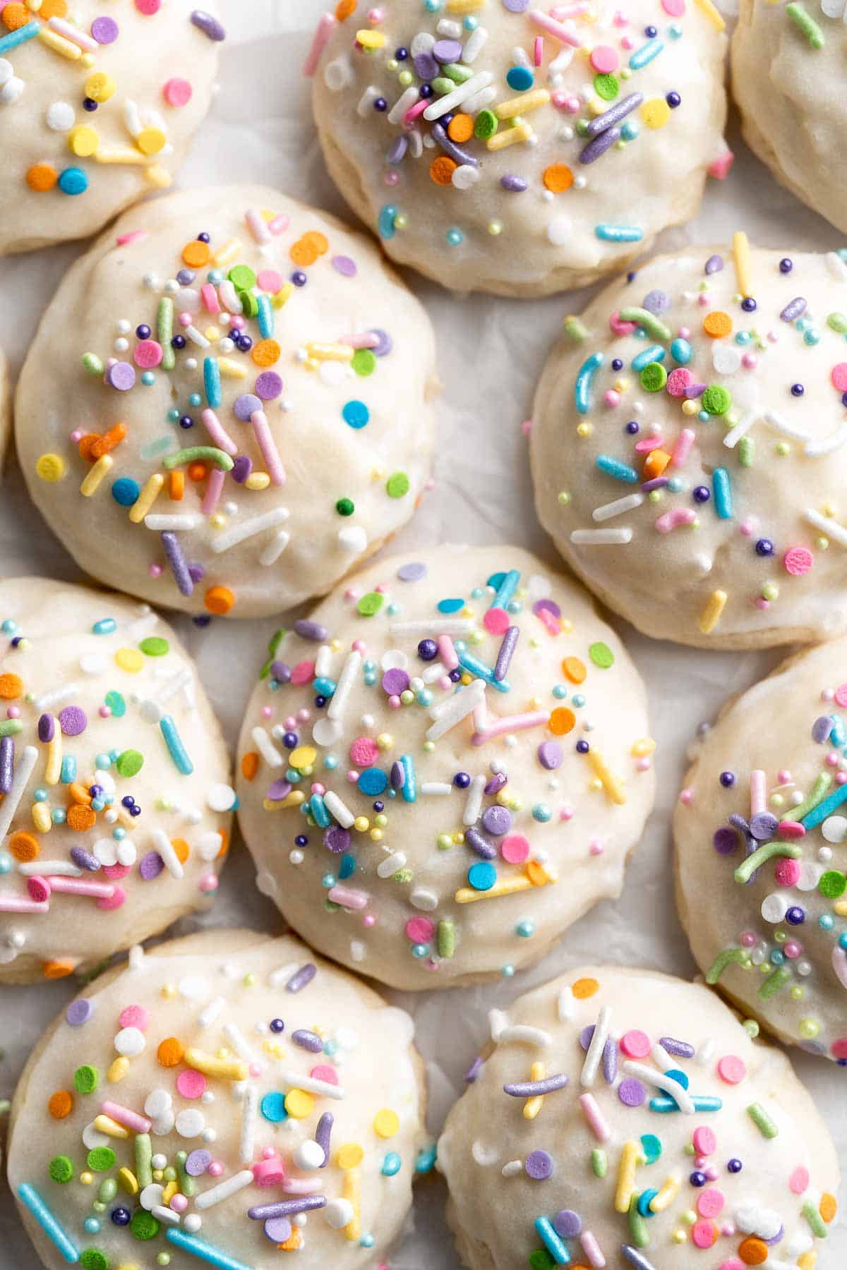 Italian Easter Cookies are cake-like cookies that are light and fluffy with lemon flavor throughout and topped with an easy homemade glaze and sprinkles. | aheadofthyme.com