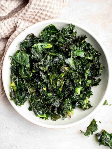 You’ll never want to buy chips after trying these incredibly light and crispy homemade Kale Chips! They’re completely vegan, easy to make, and healthy. | aheadofthyme.com