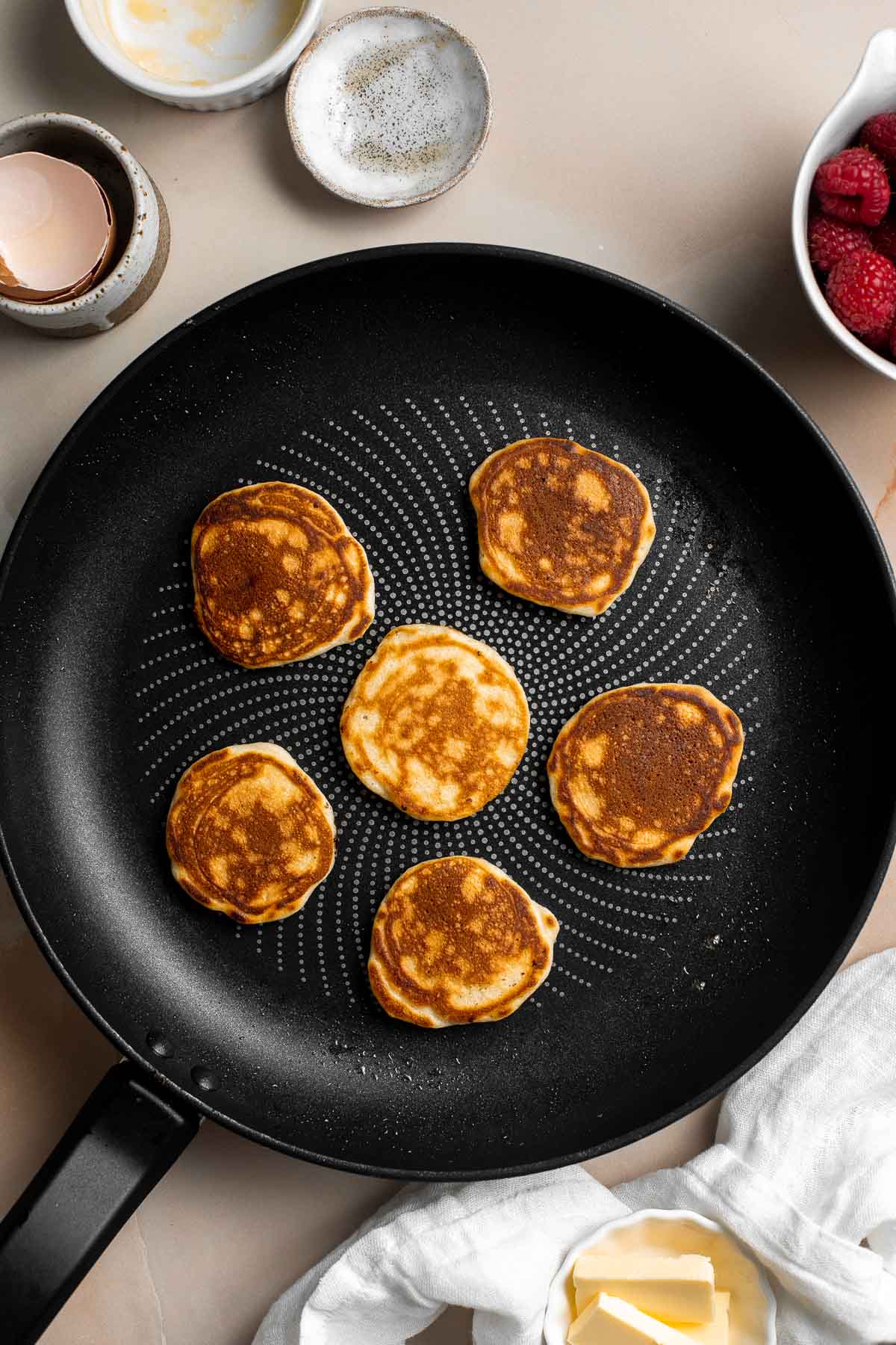 Mini Pancakes (Silver Dollar Pancakes) are the fluffy, fun-sized version of classic pancakes. They're easy to make using a handful of everyday ingredients. | aheadofthyme.com