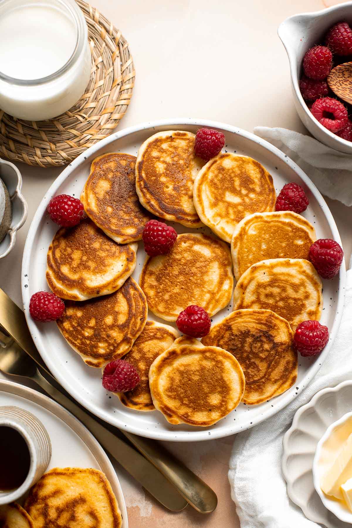 Mini Pancakes (Silver Dollar Pancakes) are the fluffy, fun-sized version of classic pancakes. They're easy to make using a handful of everyday ingredients. | aheadofthyme.com