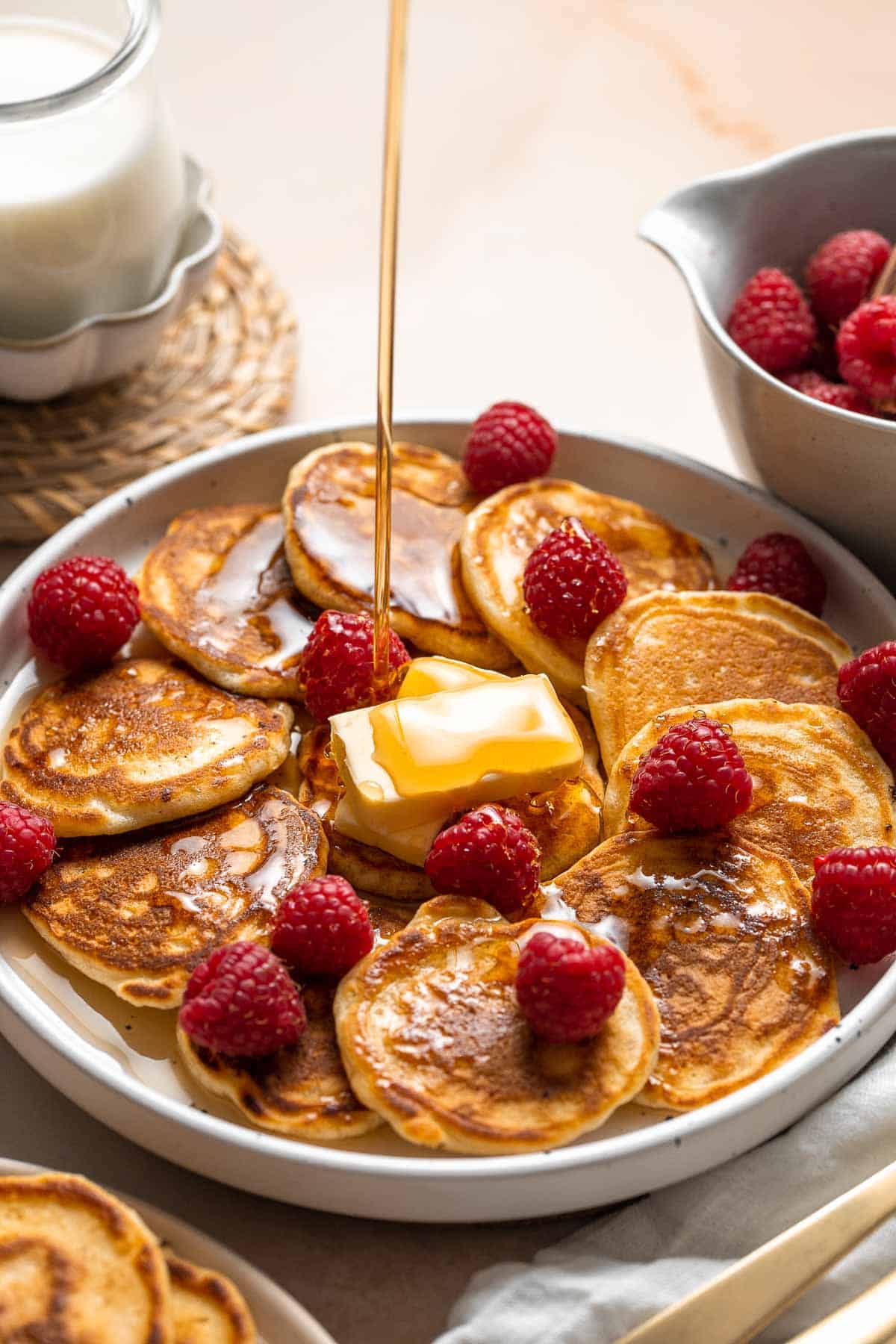 Mini Pancakes (Silver Dollar Pancakes) are the fluffy, fun-sized version of classic pancakes. They're easy to make using a handful of everyday ingredients. | aheadofthyme.com