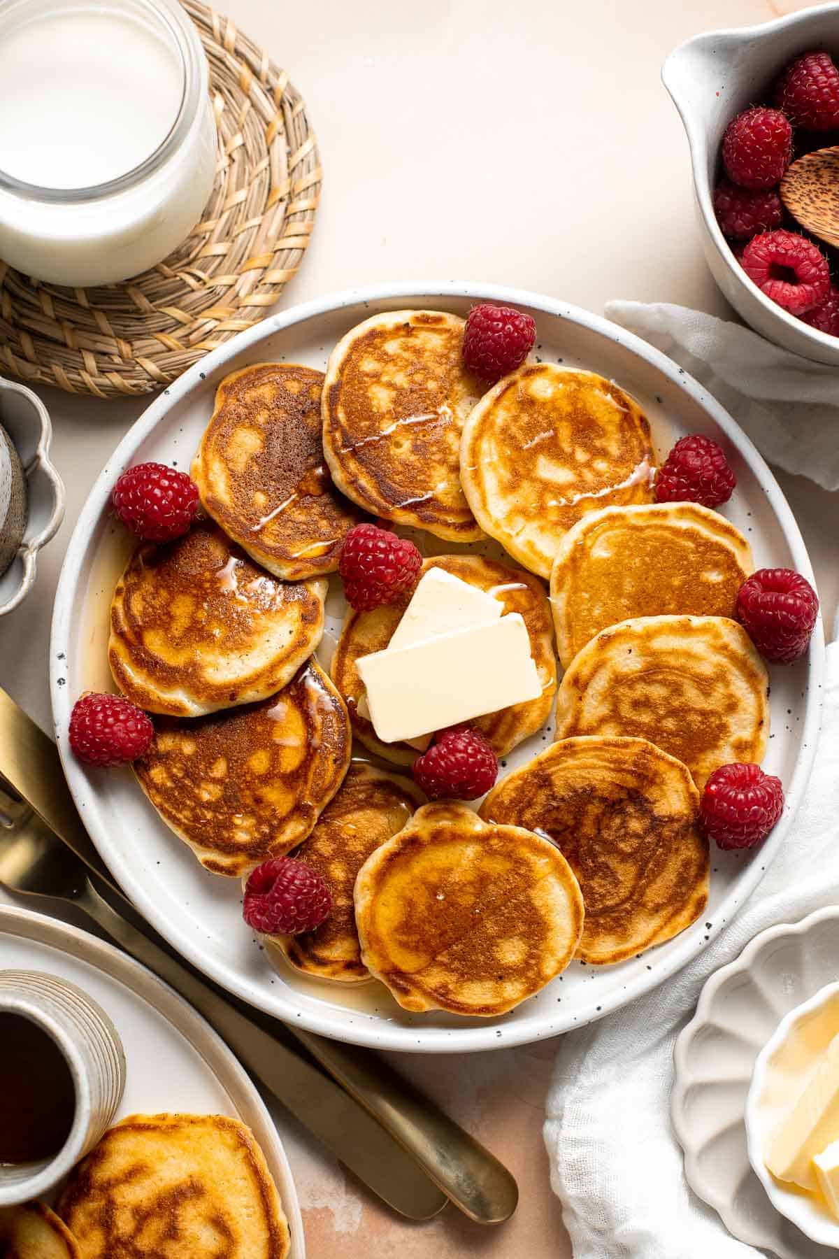 Mini Pancakes (Silver Dollar Pancakes) are the fluffy, fun-sized version of classic pancakes. They're easy to make using a handful of everyday ingredients. | aheadofthyme.com