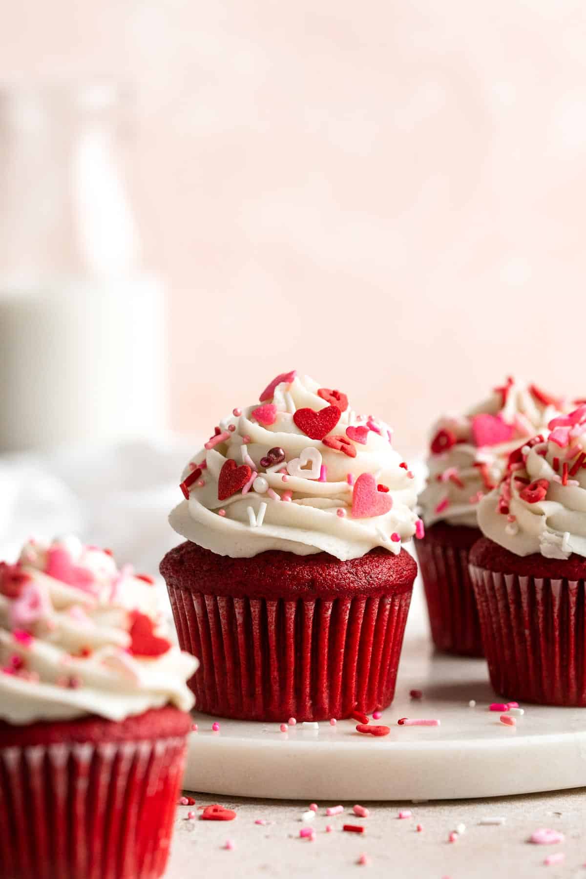 These Red Velvet Cupcakes with cream cheese frosting are delicious, moist, rich, and perfectly sweet. Top these Valentine’s cupcakes with festive sprinkles. | aheadofthyme.com