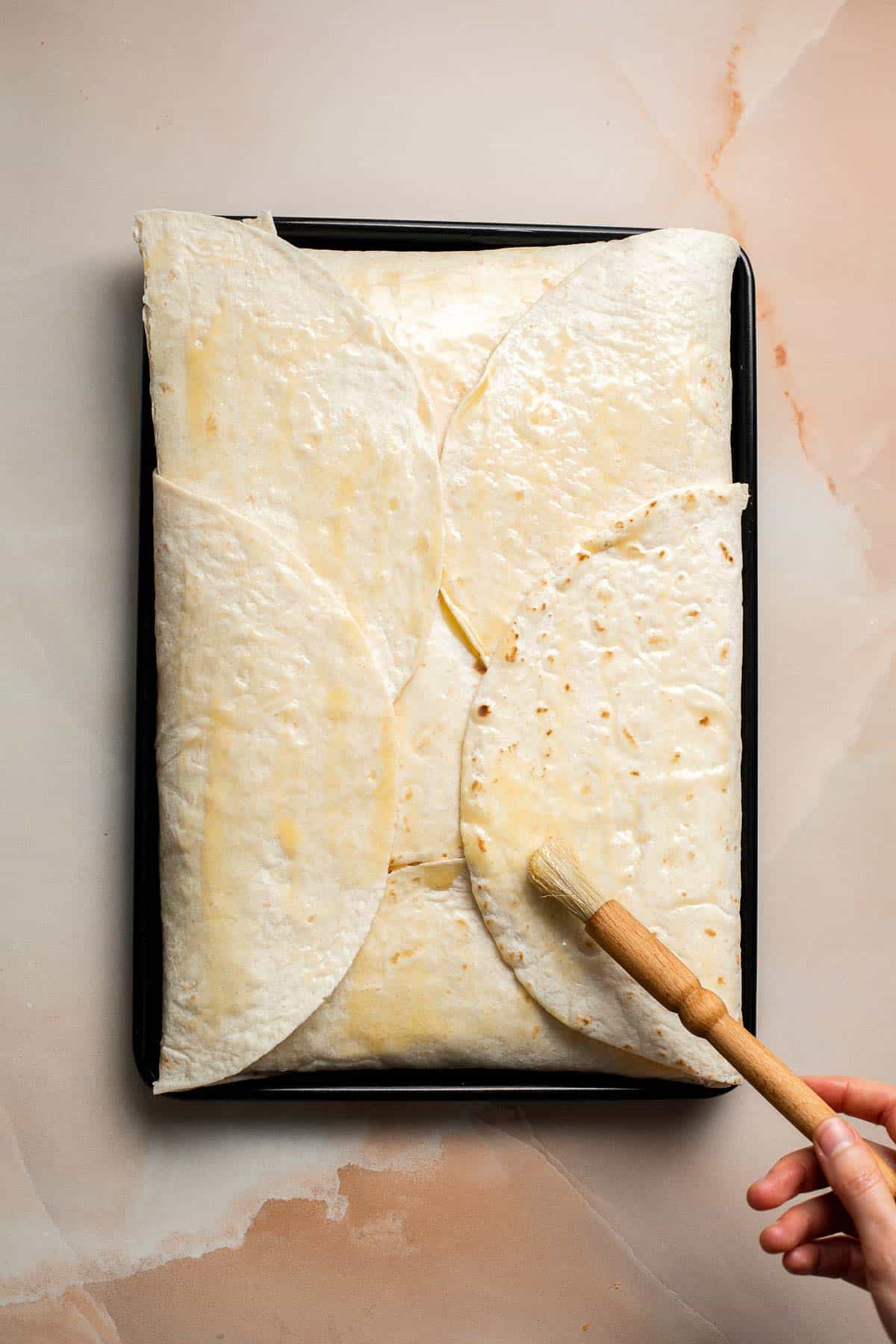 These Sheet Pan Quesadillas are loaded with veggies and gooey cheese, baked in the oven until crispy, and made to feed a crowd in just 30 minutes. | aheadofthyme.com