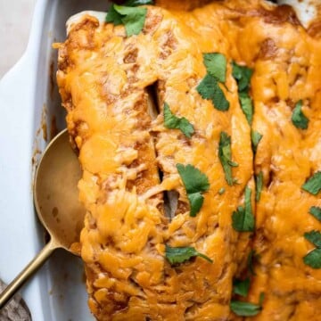 Shredded Beef Enchiladas are flavorful, saucy, and cheesy. They are easy to make for family dinner using just a few ingredients including leftover beef. | aheadofthyme.com