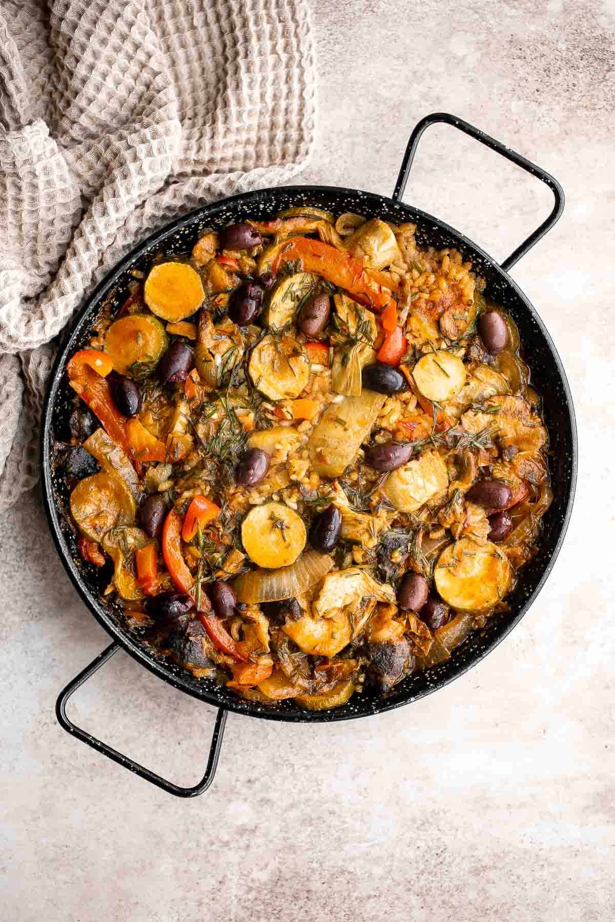 Vegetarian Paella is a delicious flavorful classic Spanish rice dish that is hearty and filling — perfectly cooked rice with saffron and vegetables. | aheadofthyme.com