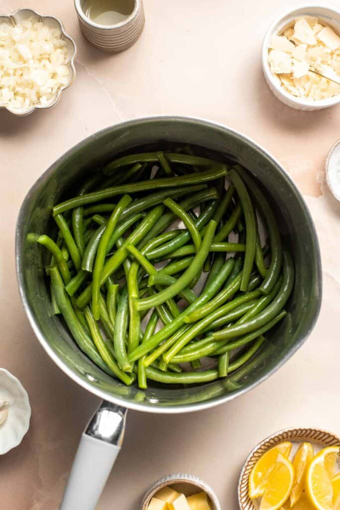Lemon Parmesan Green Beans are the perfect side to any entree dinner meal — buttery, lemony, and cheesy. This quick side dish is easy to make in 20 minutes. | aheadofthyme.com