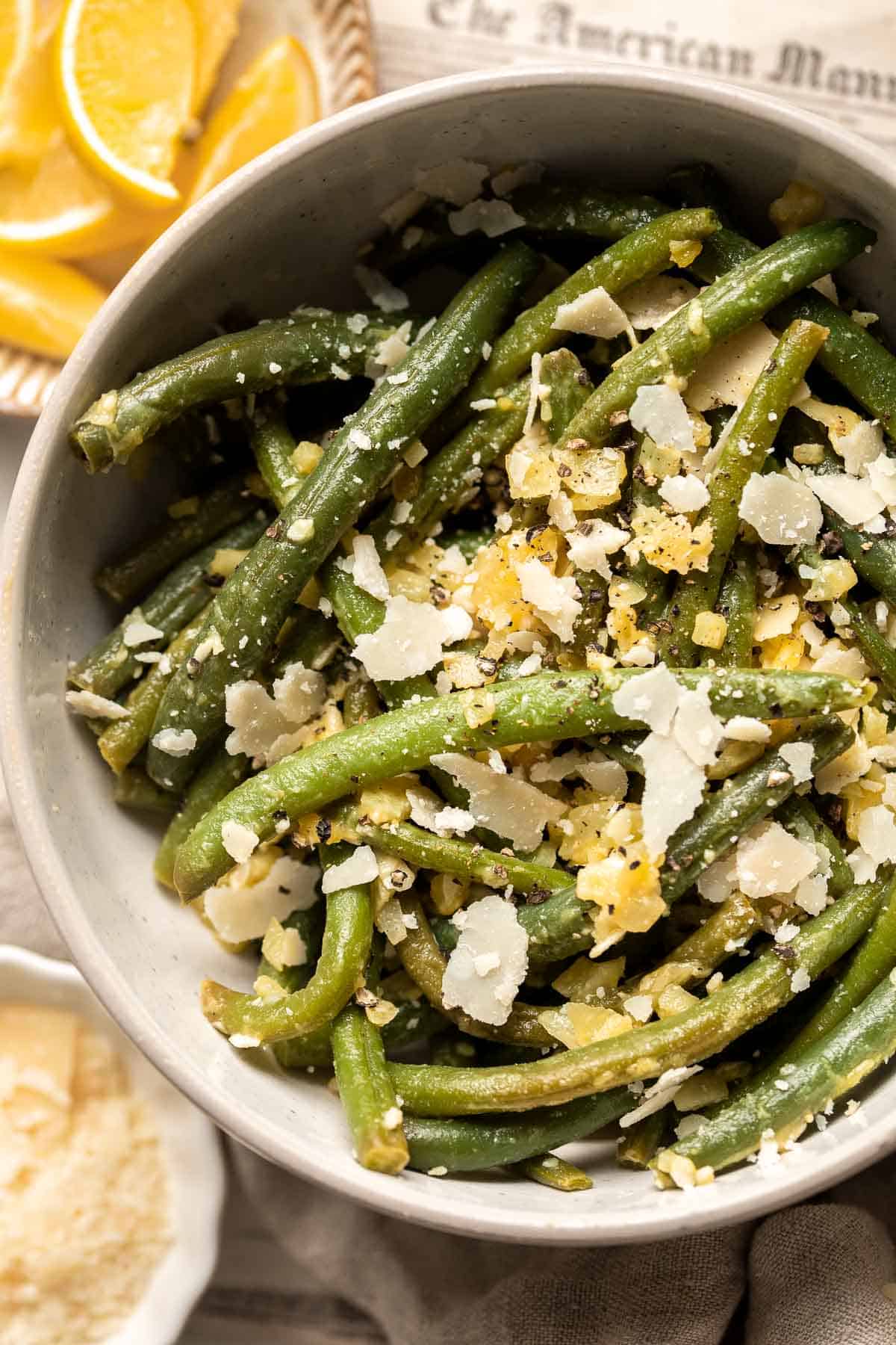 Lemon Parmesan Green Beans are the perfect side to any entree dinner meal — buttery, lemony, and cheesy. This quick side dish is easy to make in 20 minutes. | aheadofthyme.com