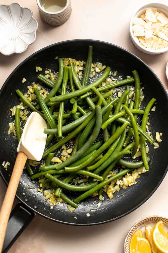 Lemon Parmesan Green Beans are the perfect side to any entree dinner meal — buttery, lemony, and cheesy. This quick side dish is easy to make in 20 minutes. | aheadofthyme.com