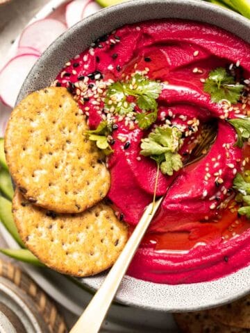 Beet Hummus is a smooth and creamy vegan dip that is made with healthy ingredients including real beets. It's flavorful, delicious, vibrant and colorful. | aheadofthyme.com