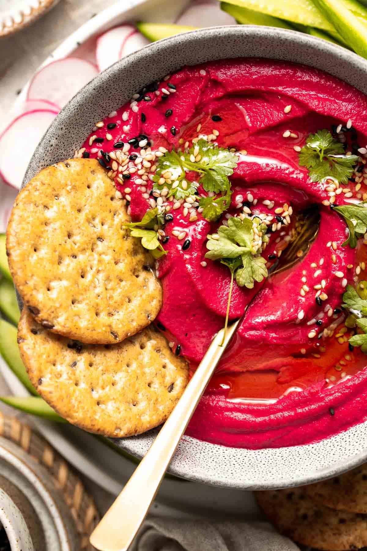 Beet Hummus is a smooth and creamy vegan dip that is made with healthy ingredients including real beets. It's flavorful, delicious, vibrant and colorful. | aheadofthyme.com